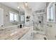 Stylish bathroom with granite vanity, modern lighting, and a glass-enclosed shower with decorative tile at 9749 Meade Cir, Westminster, CO 80031