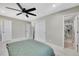 Large bedroom with ceiling fan, and ensuite bathroom with glass enclosed shower at 9749 Meade Cir, Westminster, CO 80031