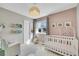 Charming Bedroom with crib, rocking chair, and decorative elements at 9749 Meade Cir, Westminster, CO 80031