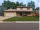 Traditional two-story home featuring an attached two-car garage and well-manicured lawn at 9749 Meade Cir, Westminster, CO 80031