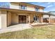 Charming two-story home with a covered porch, brick facade, and manicured front yard at 9749 Meade Cir, Westminster, CO 80031