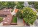 Aerial view of the property and the surrounding neighborhood with mature trees at 1295 S Downing St, Denver, CO 80210