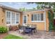 Charming backyard with stone patio, dining set, and landscaped features at 1295 S Downing St, Denver, CO 80210
