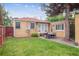 Large backyard with stone patio and outdoor dining area at 1295 S Downing St, Denver, CO 80210