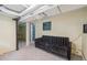 Basement area showcasing a comfortable sofa and bright window at 1295 S Downing St, Denver, CO 80210