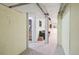 Basement hallway with view of finished room and stairs at 1295 S Downing St, Denver, CO 80210