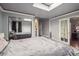 Bedroom showcasing a large mirrored closet, a skylight, and views into an adjoining room at 1295 S Downing St, Denver, CO 80210