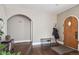 Entryway with wood floors, arched doorways, and vintage details at 1295 S Downing St, Denver, CO 80210