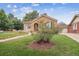 Lovely home with stucco and tile roof with manicured front yard at 1295 S Downing St, Denver, CO 80210