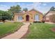 Inviting stucco home with red tile roof and a stone pathway at 1295 S Downing St, Denver, CO 80210