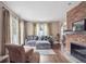 Inviting living room with fireplace, wood floors, and comfortable seating at 1295 S Downing St, Denver, CO 80210