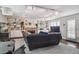 Spacious living room with a cozy fireplace, built-in bookshelves, and stylish track lighting at 1295 S Downing St, Denver, CO 80210