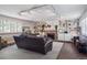 Inviting living room with a brick fireplace, built-in bookshelves, and comfortable seating at 1295 S Downing St, Denver, CO 80210