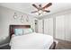 Comfortable bedroom with a queen bed, hardwood floors, and plenty of closet space at 1391 Elmira St, Aurora, CO 80010