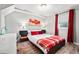Well-lit bedroom with modern decor, a comfortable bed with bright accents, and a cozy, inviting atmosphere at 1391 Elmira St, Aurora, CO 80010
