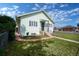 Charming home featuring a well-maintained lawn, brick-lined flower beds, and inviting curb appeal at 1391 Elmira St, Aurora, CO 80010