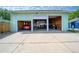 Spacious three car garage with open doors and natural light at 1391 Elmira St, Aurora, CO 80010