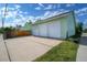 Spacious detached three car garage with white doors and ample parking space at 1391 Elmira St, Aurora, CO 80010