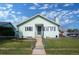 Charming home featuring a well-maintained front yard, a cozy porch, and a classic design at 1391 Elmira St, Aurora, CO 80010