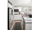 Efficient kitchen with stainless steel appliances, light cabinetry, and plenty of counter space for meal preparation at 1391 Elmira St, Aurora, CO 80010