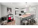 Bright kitchen with modern appliances, sleek countertops, and stylish bar seating for casual dining at 1391 Elmira St, Aurora, CO 80010