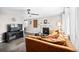 Cozy living room showcasing a tiled fireplace, comfortable sofa, and updated flooring at 1391 Elmira St, Aurora, CO 80010