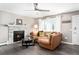Bright living room with a modern fireplace, a large window, and hardwood floors at 1391 Elmira St, Aurora, CO 80010