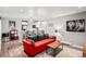 Inviting living space with a comfortable couch, open layout, and modern decor, flowing into the kitchen at 1391 Elmira St, Aurora, CO 80010