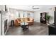 Bright living room featuring a decorative fireplace, plush sofa, and modern ceiling fan at 1391 Elmira St, Aurora, CO 80010