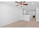 Spacious carpeted bedroom with ceiling fan, with access to bathroom area at 11935 Riverstone Cir # 6D, Henderson, CO 80640