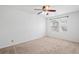 Bright and airy bedroom with ceiling fan, carpet floors, and window views at 11935 Riverstone Cir # 6D, Henderson, CO 80640