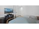 Comfortable bedroom with television and large bed at 11935 Riverstone Cir # 6D, Henderson, CO 80640