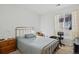 Relaxing bedroom featuring calming decor, a large window, and a comfortable place to unwind at 11935 Riverstone Cir # 6D, Henderson, CO 80640