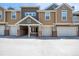 Townhome exterior with garage and unique architecture at 11935 Riverstone Cir # 6D, Henderson, CO 80640
