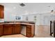 Modern kitchen with stainless steel appliances, breakfast bar, and light wood flooring at 11935 Riverstone Cir # 6D, Henderson, CO 80640