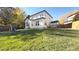 Landscaped backyard with a pergola and patio at 16355 Flintlock Ct, Parker, CO 80134