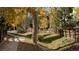 Walking path in community with autumn leaves at 16355 Flintlock Ct, Parker, CO 80134