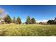 Community park with grassy area and playground structure at 16355 Flintlock Ct, Parker, CO 80134