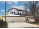 Two-story house with a three-car garage and landscaped yard at 16355 Flintlock Ct, Parker, CO 80134