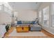 Living room with hardwood floors and large windows at 16355 Flintlock Ct, Parker, CO 80134