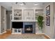 Cozy living room featuring a fireplace and built-in shelving at 16355 Flintlock Ct, Parker, CO 80134