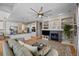 Living room with fireplace, built-in shelving, and hardwood floors at 16355 Flintlock Ct, Parker, CO 80134