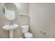 Small bathroom with pedestal sink and toilet at 3272 Brushwood Dr, Castle Rock, CO 80109