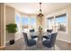 Spacious dining room with bay window and chandelier at 3272 Brushwood Dr, Castle Rock, CO 80109