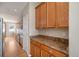 View of kitchen with wood cabinets and granite countertops at 3272 Brushwood Dr, Castle Rock, CO 80109