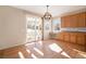 Eat-in kitchen with oak cabinets and access to backyard at 3272 Brushwood Dr, Castle Rock, CO 80109