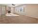 Spacious living room featuring a fireplace and ample natural light at 3272 Brushwood Dr, Castle Rock, CO 80109