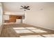 Open living room with view into kitchen and dining area at 3272 Brushwood Dr, Castle Rock, CO 80109