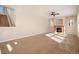 Living room with fireplace and stairs to upper level at 3272 Brushwood Dr, Castle Rock, CO 80109