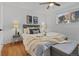Serene bedroom with a comfortable bed and ample natural light at 7615 E Quincy Ave # 103, Denver, CO 80237